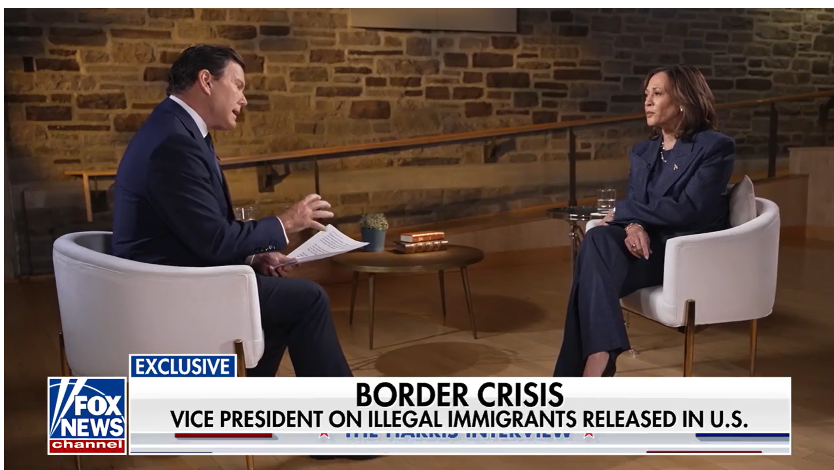 A person and person sitting in chairs talking Description automatically generated