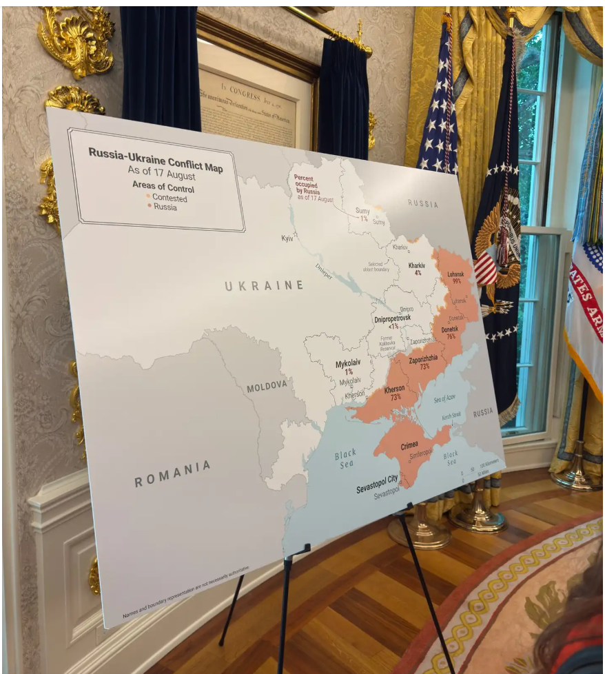 A map of ukraine in a room with flags and a gold frame

AI-generated content may be incorrect.